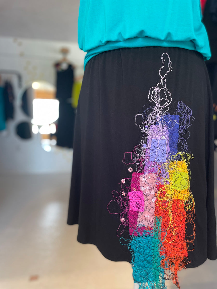 BLACK A-SHAPED SKIRT WITH MULTICOLORED EMBROIDERY