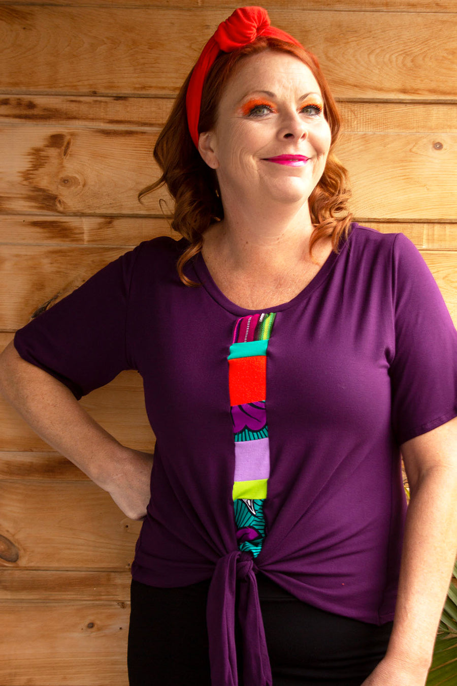 PLUM TOP THAT TIES AT THE WAIST WITH MIXED FABRIC BAND AT THE FRONT